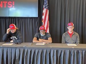 Three Buhler High School students signed letters of intent to attend Hutchinson Community College next year Dalin Coffey, Marcus Voss, and Ethan McGillivray will enroll in the fall.