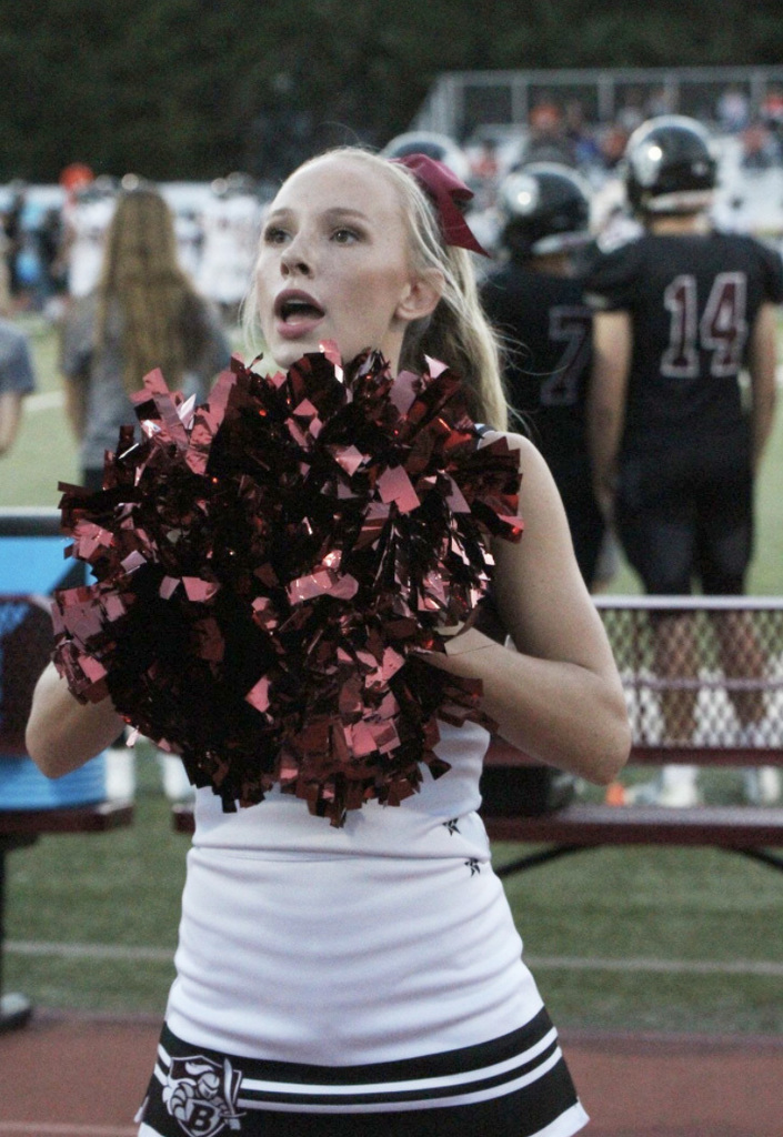 Cheering for the Buhler Football Team is Kelsey Spann, sr. The Cheer Team is bringing the hype as we go against McPherson tonight. 